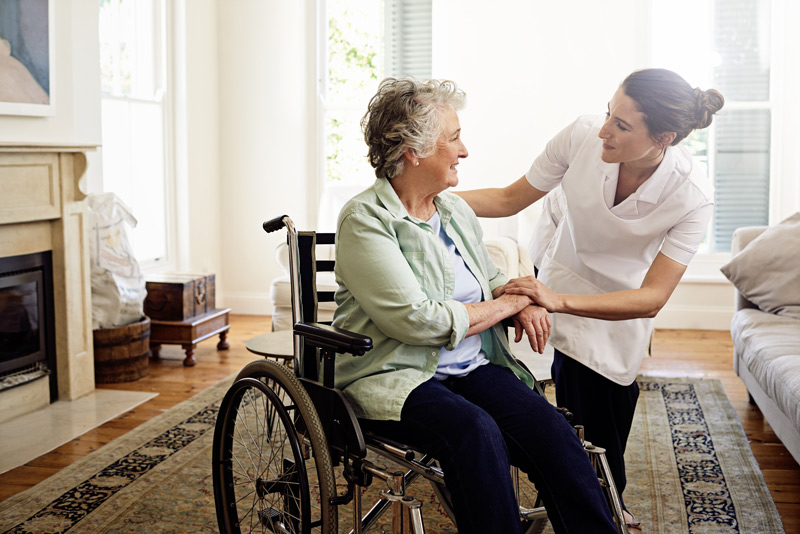 shot-of-a-smiling-caregiver-helping-a-senior-woman3
